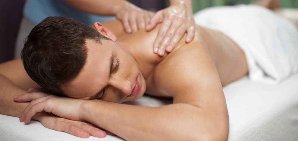 Silk foot massage applying gentle kneading and acupressure on the feet